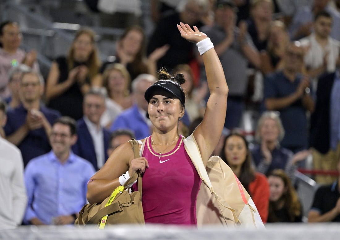 Aug 8, 2023; Montreal, Quebec, Canada; Bianca Andreescu (CAN) waves to the crowd after her defeat against Camila Giorgi (ITA) (not pictured) during first round play at IGA Stadium. Mandatory Credit: Eric Bolte-USA TODAY Sports