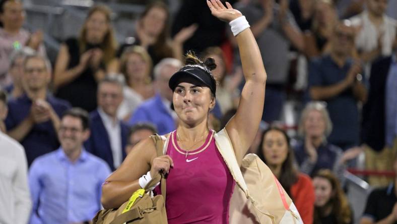 Aug 8, 2023; Montreal, Quebec, Canada; Bianca Andreescu (CAN) waves to the crowd after her defeat against Camila Giorgi (ITA) (not pictured) during first round play at IGA Stadium. Mandatory Credit: Eric Bolte-USA TODAY Sports