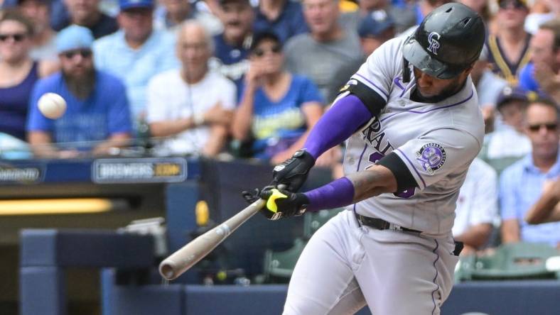 Aug 9, 2023; Milwaukee, Wisconsin, USA; Colorado Rockies designated hitter Jurickson Profar (29) hits a solo home run against the Milwaukee Brewers in the fourth inning at American Family Field. Mandatory Credit: Benny Sieu-USA TODAY Sports