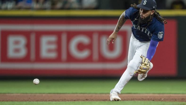 Aug 9, 2023; Seattle, Washington, USA; Seattle Mariners shortstop J.P. Crawford (3) fields a ground ball during the eighth inning against the San Diego Padres at T-Mobile Park. Mandatory Credit: Stephen Brashear-USA TODAY Sports