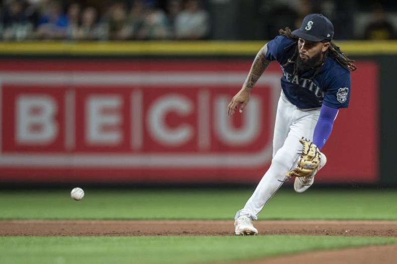 Aug 9, 2023; Seattle, Washington, USA; Seattle Mariners shortstop J.P. Crawford (3) fields a ground ball during the eighth inning against the San Diego Padres at T-Mobile Park. Mandatory Credit: Stephen Brashear-USA TODAY Sports
