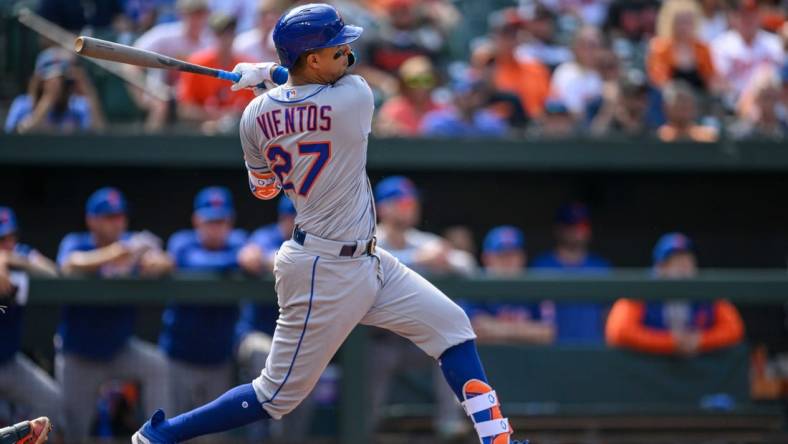 Aug 6, 2023; Baltimore, Maryland, USA; New York Mets third baseman Mark Vientos (27) hits a double during the ninth inning against the Baltimore Orioles at Oriole Park at Camden Yards. Mandatory Credit: Reggie Hildred-USA TODAY Sports