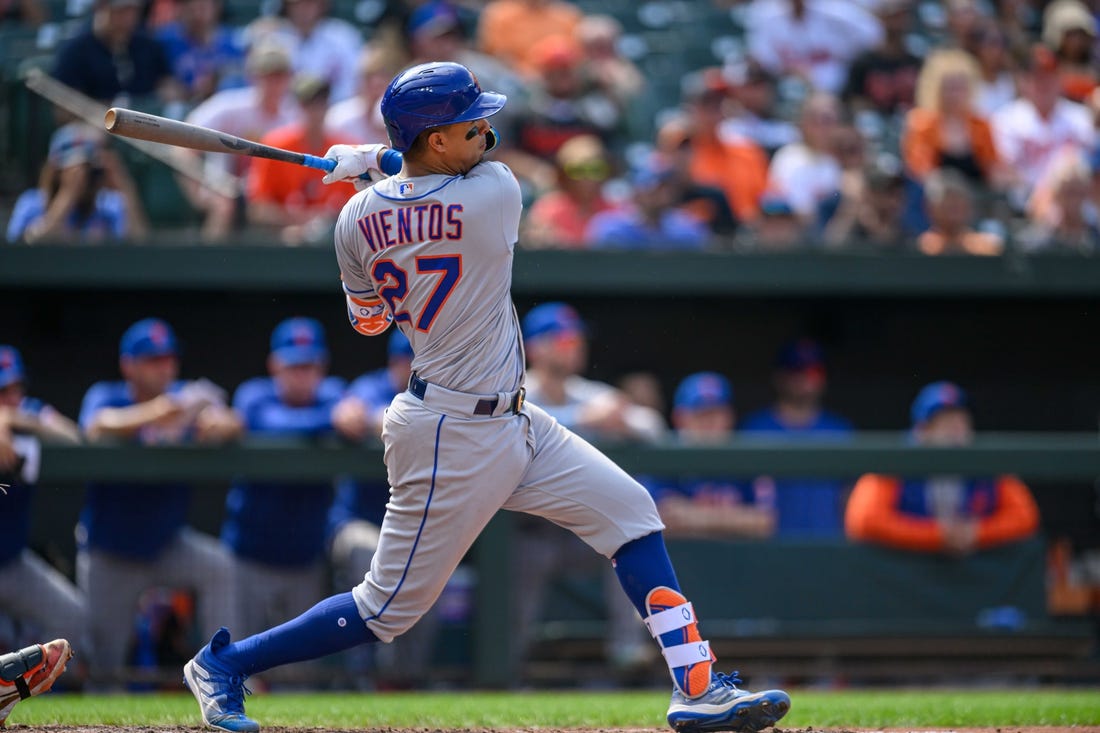 Aug 6, 2023; Baltimore, Maryland, USA; New York Mets third baseman Mark Vientos (27) hits a double during the ninth inning against the Baltimore Orioles at Oriole Park at Camden Yards. Mandatory Credit: Reggie Hildred-USA TODAY Sports