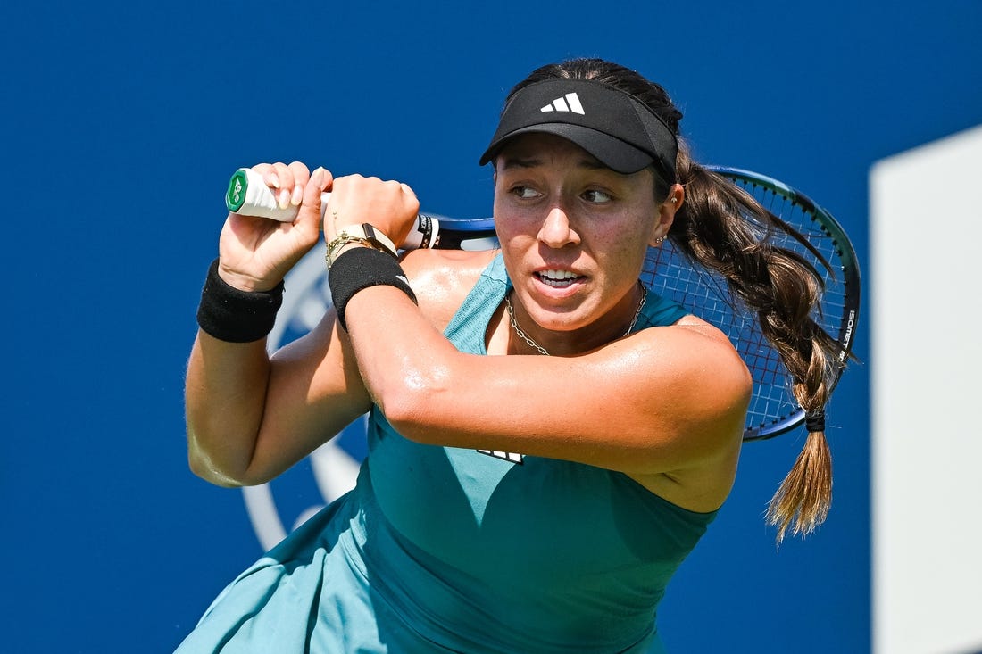 Aug 10, 2023; Montreal, Quebec, Canada; Jessica Pegula (USA) tracks her shot against Jasmine Paolini (ITA) (not pictured) during third round play at IGA Stadium. Mandatory Credit: David Kirouac-USA TODAY Sports