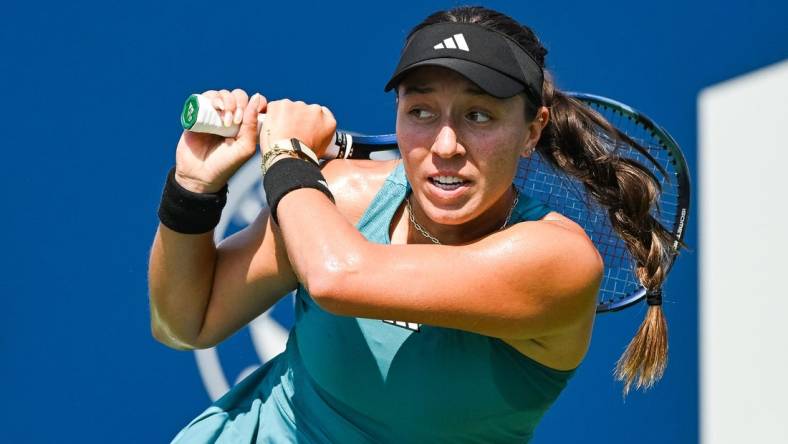 Aug 10, 2023; Montreal, Quebec, Canada; Jessica Pegula (USA) tracks her shot against Jasmine Paolini (ITA) (not pictured) during third round play at IGA Stadium. Mandatory Credit: David Kirouac-USA TODAY Sports