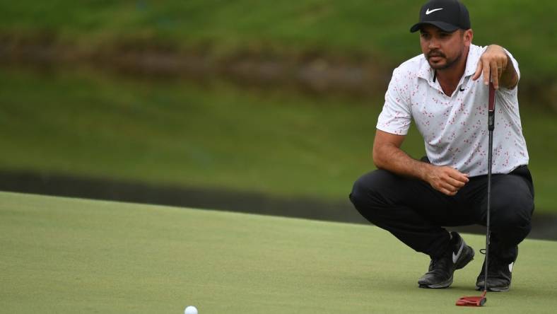 Aug 10, 2023; Memphis, Tennessee, USA; Jason Day lines up a putt on the 18th green during the first round of the FedEx St. Jude Championship golf tournament. Mandatory Credit: Christopher Hanewinckel-USA TODAY Sports