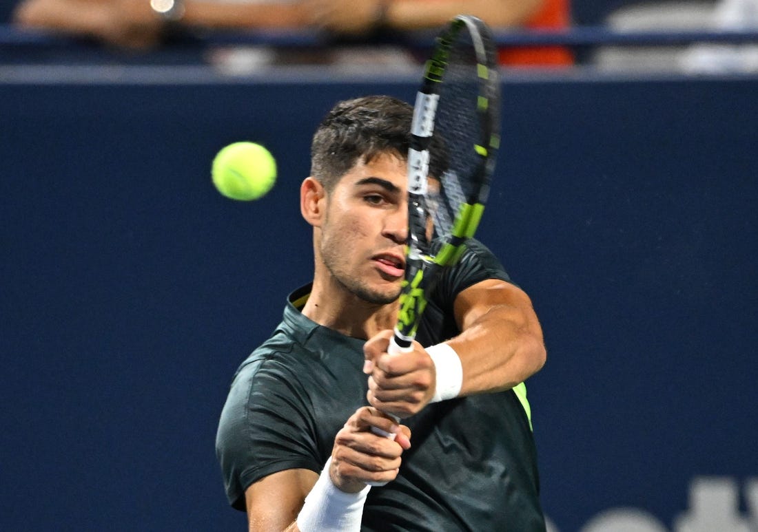 Aug 10, 2023; Toronto, Ontario, Canada;  Carlos Alcaraz (ESP) plays a shot against Hubert Hurkacz (POL) (not pictured) in third round play at Sobeys Stadium. Mandatory Credit: Dan Hamilton-USA TODAY Sports