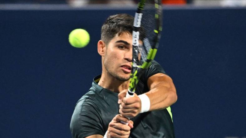 Aug 10, 2023; Toronto, Ontario, Canada;  Carlos Alcaraz (ESP) plays a shot against Hubert Hurkacz (POL) (not pictured) in third round play at Sobeys Stadium. Mandatory Credit: Dan Hamilton-USA TODAY Sports