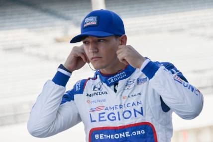 Chip Ganassi Racing driver Alex Palou (10) puts in his hearing protection Friday, Aug. 11, 2023, during practice for the Gallagher Grand Prix at Indianapolis Motor Speedway.