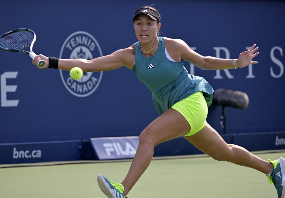 Aug 11, 2023; Montreal, Quebec, Canada; Jessica Pegula (USA) hits a forehand against Coco Gauff (USA) (not pictured) during quarterfinal play at IGA Stadium. Mandatory Credit: Eric Bolte-USA TODAY Sports