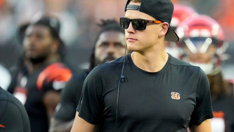 Cincinnati Bengals quarterback Joe Burrow (9) watches from the sideline in the second quarter of the NFL Preseason Week 1 game between the Cincinnati Bengals and the Green Bay Packers at Paycor Stadium in downtown Cincinnati on Friday, Aug. 11, 2023. The Packers led 21-16 at halftime.