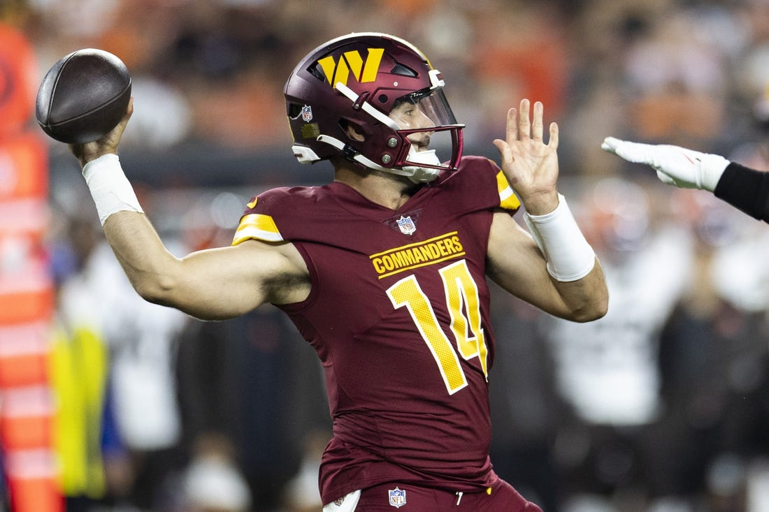 Aug 11, 2023; Cleveland, Ohio, USA; Washington Commanders quarterback Sam Howell (14) throws the ball against the Cleveland Browns during the first quarter at Cleveland Browns Stadium. Mandatory Credit: Scott Galvin-USA TODAY Sports