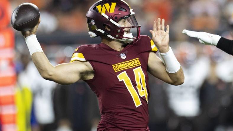 Aug 11, 2023; Cleveland, Ohio, USA; Washington Commanders quarterback Sam Howell (14) throws the ball against the Cleveland Browns during the first quarter at Cleveland Browns Stadium. Mandatory Credit: Scott Galvin-USA TODAY Sports