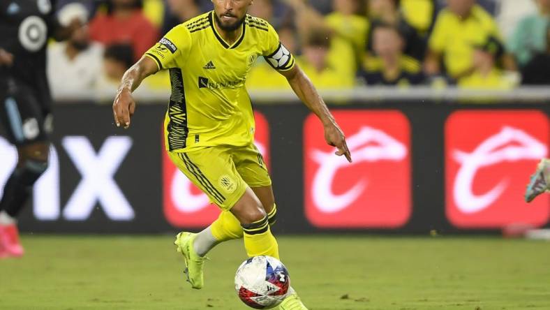 Aug 11, 2023; Nashville, TN, USA; Nashville SC midfielder Hany Mukhtar (10) dribbles the ball against the Minnesota United during the second half at GEODIS Park. Mandatory Credit: Steve Roberts-USA TODAY Sports