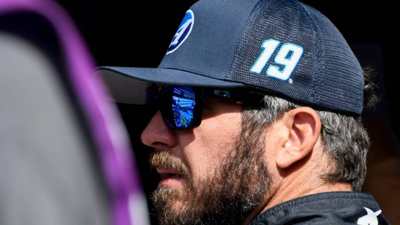 NASCAR Cup Series driver Martin Truex Jr. (19) stands by his car Saturday, Aug. 12, 2023, during practice for the NASCAR Cup Series Verizon 200 at Indianapolis Motor Speedway.