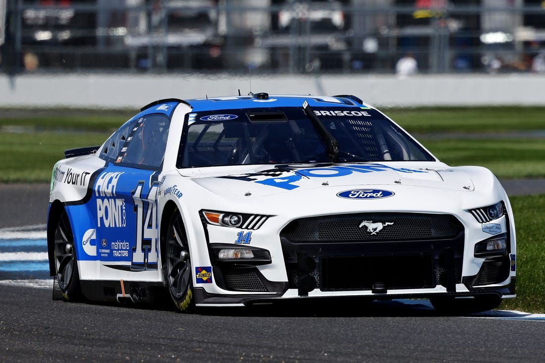 Aug 12, 2023; Speedway, Indiana, USA; NASCAR Cup Series driver Chase Briscoe (14) during qualifying for the Verizon 200 at the Brickyard at Indianapolis Motor Speedway Road Course. Mandatory Credit: Mike Dinovo-USA TODAY Sports