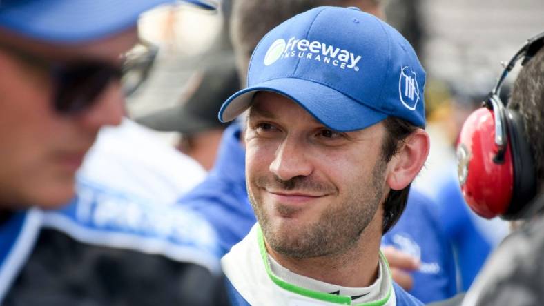 NASCAR Cup Series driver Daniel Suarez (99) smiles after securing pole position Saturday, Aug. 12, 2023, during qualifying for the NASCAR Cup Series Verizon 200 at Indianapolis Motor Speedway.