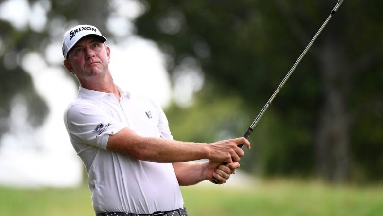 Aug 12, 2023; Memphis, Tennessee, USA; Lucas Glover hits his second shot on the ninth hole during the third round of the FedEx St. Jude Championship golf tournament. Mandatory Credit: Christopher Hanewinckel-USA TODAY Sports