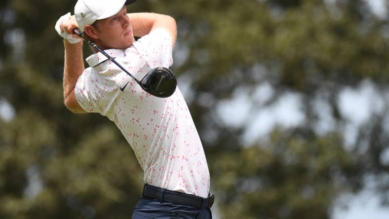 Aug 12, 2023; Memphis, Tennessee, USA; Cam Davis watches his tee shot on the seventh hole during the third round of the FedEx St. Jude Championship golf tournament. Mandatory Credit: Christopher Hanewinckel-USA TODAY Sports