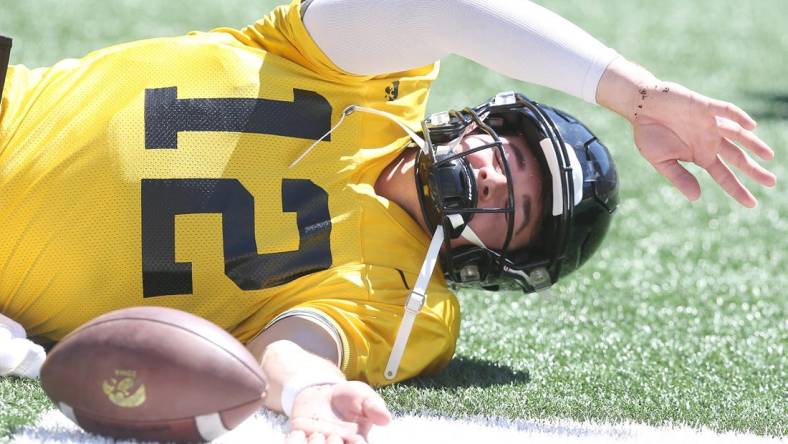 Iowa quarterback Cade McNamara warms up before scrimmaging during Kids' Day at Kinnick at Kinnick Stadium on Saturday, Aug. 12, 2023, in Iowa City, Iowa