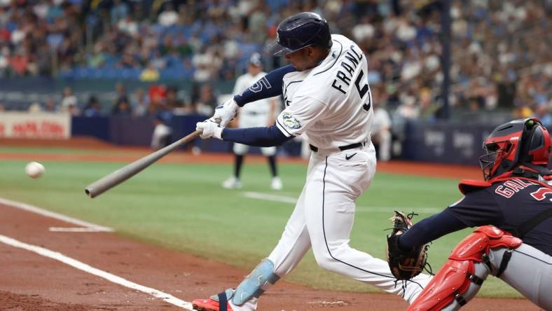 Aug 12, 2023; St. Petersburg, Florida, USA;  Tampa Bay Rays shortstop Wander Franco (5) singles against the Cleveland Guardians during the first inning at Tropicana Field. Mandatory Credit: Kim Klement Neitzel-USA TODAY Sports