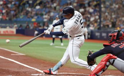 Aug 12, 2023; St. Petersburg, Florida, USA;  Tampa Bay Rays shortstop Wander Franco (5) singles against the Cleveland Guardians during the first inning at Tropicana Field. Mandatory Credit: Kim Klement Neitzel-USA TODAY Sports