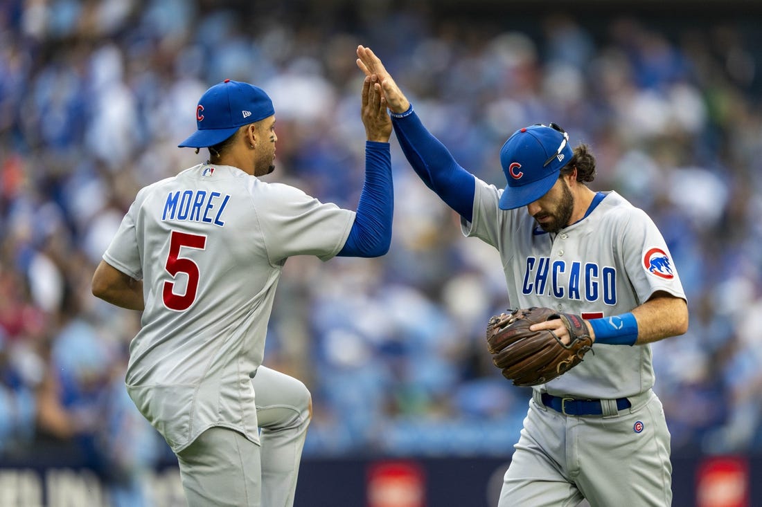 Aug 12, 2023; Toronto, Ontario, CAN; Chicago Cubs second baseman Christopher Morel (5) celebrates with teammate shortstop Dansby Swanson (7) after defeating the Toronto Blue Jays at Rogers Centre. Mandatory Credit: Kevin Sousa-USA TODAY Sports