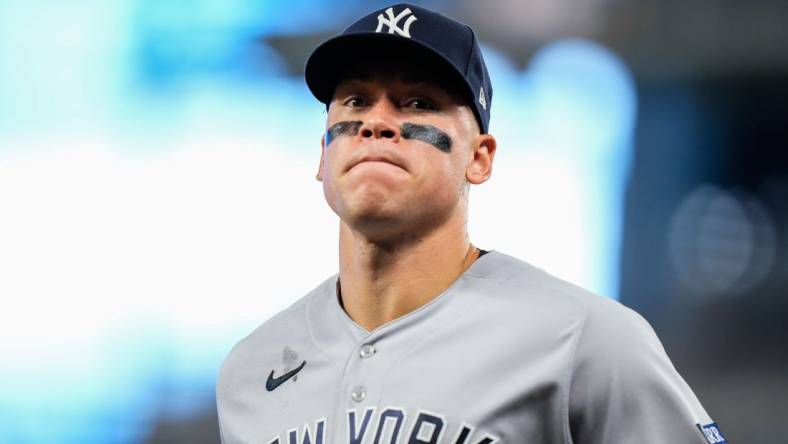 Aug 12, 2023; Miami, Florida, USA; New York Yankees right fielder Aaron Judge (99) runs back to the dug out against the Miami Marlins during the fifth inning at loanDepot Park. Mandatory Credit: Rich Storry-USA TODAY Sports