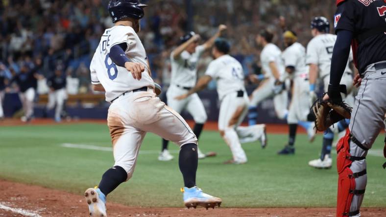 Aug 12, 2023; St. Petersburg, Florida, USA;  Tampa Bay Rays second baseman Brandon Lowe (8) scores the game winning run against the Cleveland Guardians during the ninth inning at Tropicana Field. Mandatory Credit: Kim Klement Neitzel-USA TODAY Sports