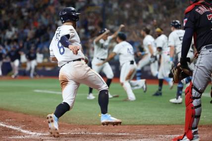 Aug 12, 2023; St. Petersburg, Florida, USA;  Tampa Bay Rays second baseman Brandon Lowe (8) scores the game winning run against the Cleveland Guardians during the ninth inning at Tropicana Field. Mandatory Credit: Kim Klement Neitzel-USA TODAY Sports