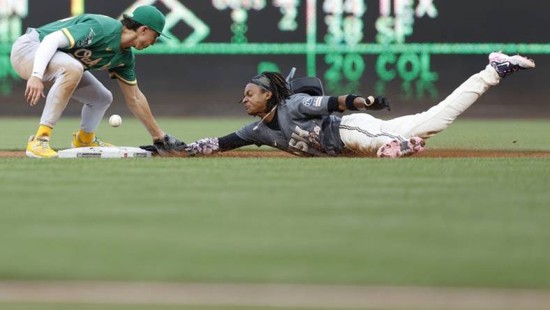 Aug 12, 2023; Washington, District of Columbia, USA; Washington Nationals shortstop CJ Abrams (5) steals second base ahead of an attempted tag by Oakland Athletics second baseman Zack Gelof (20) during the first inning at Nationals Park. Mandatory Credit: Geoff Burke-USA TODAY Sports