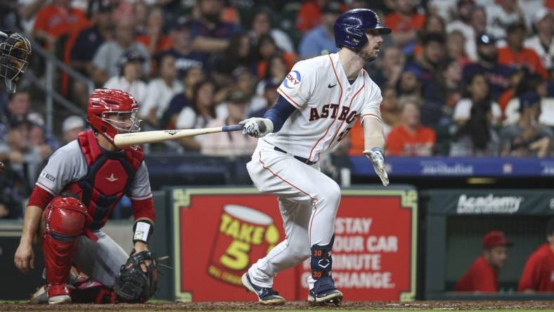 Aug 12, 2023; Houston, Texas, USA; Houston Astros right fielder Kyle Tucker (30) hits a single during the seventh inning against the Los Angeles Angels at Minute Maid Park. Mandatory Credit: Troy Taormina-USA TODAY Sports