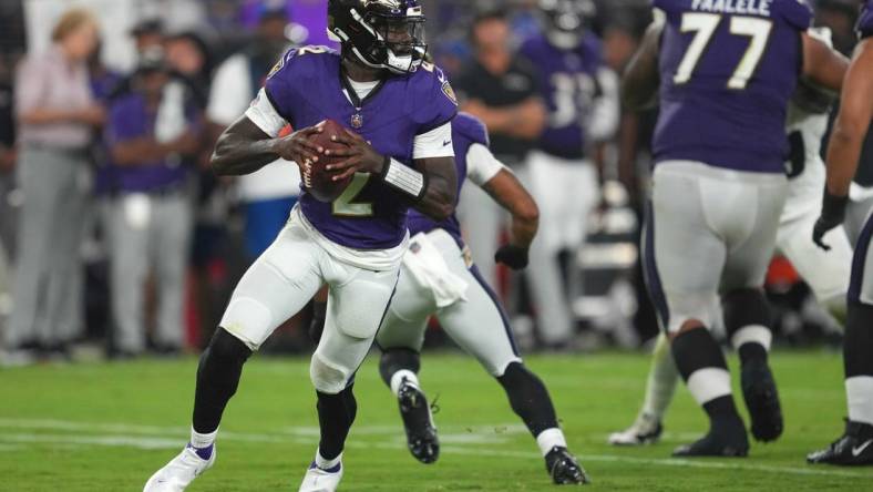 Aug 12, 2023; Baltimore, Maryland, USA; Baltimore Ravens quarterback Tyler Huntley (2) rolls out to pass in the third quarter against the Philadelphia Eagles at M&T Bank Stadium. Mandatory Credit: Mitch Stringer-USA TODAY Sports