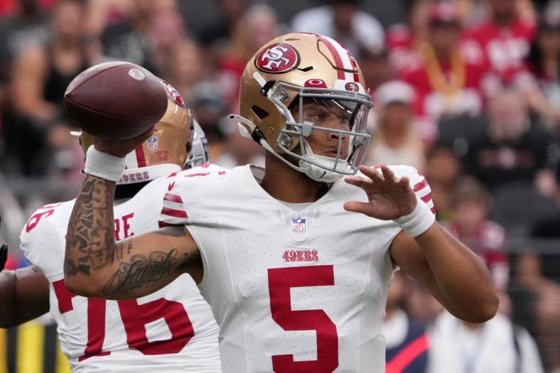 Aug 13, 2023; Paradise, Nevada, USA; San Francisco 49ers quarterback Trey Lance (5) throws the ball against the Las Vegas Raiders in the first half at Allegiant Stadium. Mandatory Credit: Kirby Lee-USA TODAY Sports