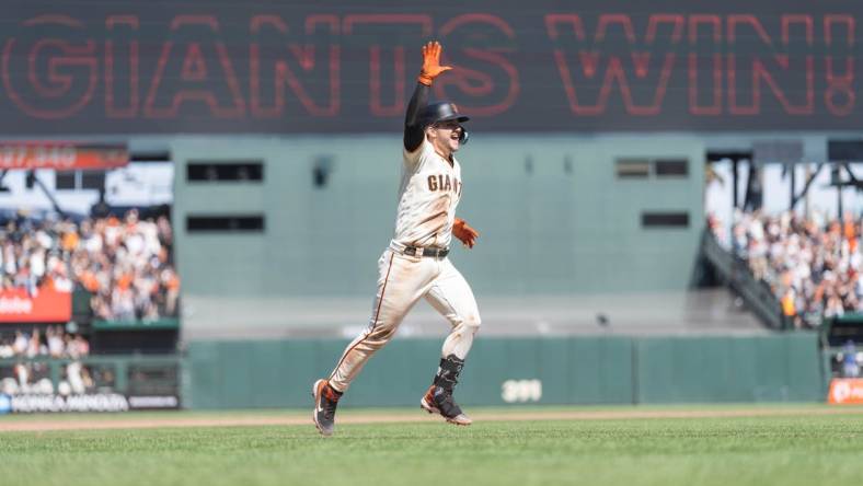 Aug 13, 2023; San Francisco, California, USA; San Francisco Giants catcher Patrick Bailey (14) celebrates after hitting a two-run walk off home run during the tenth inning to defeat the Texas Rangers at Oracle Park. Mandatory Credit: Stan Szeto-USA TODAY Sports