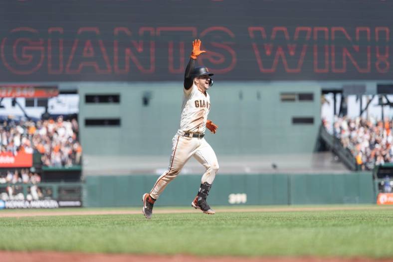 Aug 13, 2023; San Francisco, California, USA; San Francisco Giants catcher Patrick Bailey (14) celebrates after hitting a two-run walk off home run during the tenth inning to defeat the Texas Rangers at Oracle Park. Mandatory Credit: Stan Szeto-USA TODAY Sports