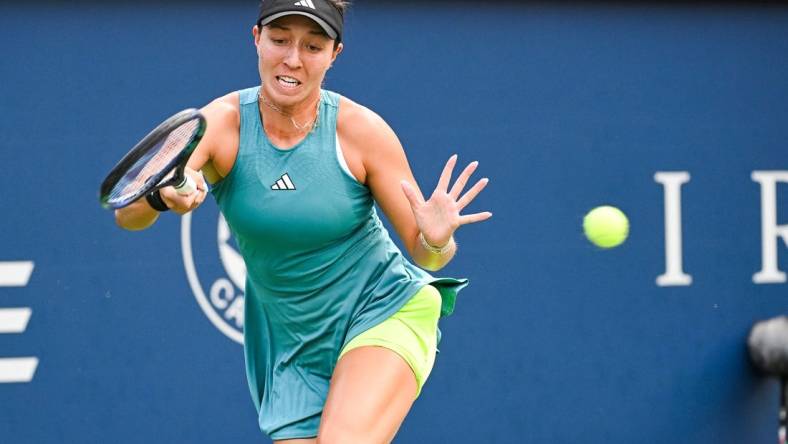 Aug 13, 2023; Montreal, Quebec, Canada; Jessica Pegula (USA) returns the ball against Liudmila Samsonova (not pictured) during singles final play at IGA Stadium. Mandatory Credit: David Kirouac-USA TODAY Sports