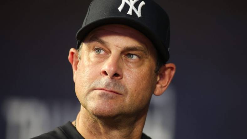 Aug 14, 2023; Atlanta, Georgia, USA; New York Yankees manager Aaron Boone (17) in the dugout against the Atlanta Braves in the third inning at Truist Park. Mandatory Credit: Brett Davis-USA TODAY Sports