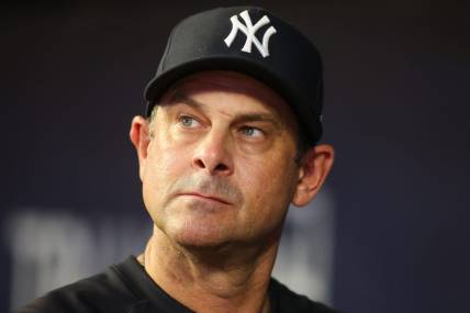 Aug 14, 2023; Atlanta, Georgia, USA; New York Yankees manager Aaron Boone (17) in the dugout against the Atlanta Braves in the third inning at Truist Park. Mandatory Credit: Brett Davis-USA TODAY Sports