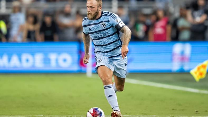 Jul 31, 2023; Kansas City, KS, USA; Sporting Kansas City forward Johnny Russell (7) controls the ball during the second half against Chivas Guadalajara at Children's Mercy Park. Mandatory Credit: Jay Biggerstaff-USA TODAY Sports