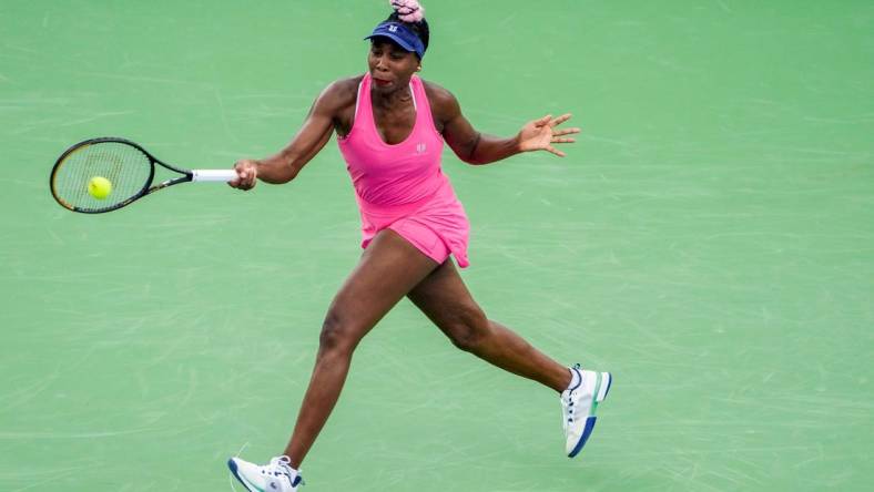 Venus Williams concentrates on her shot as she faces Veronika Kudermetova during round one of the Western & Southern Open at the Lindner Family Tennis Center in Mason Monday, August, 14, 2023.