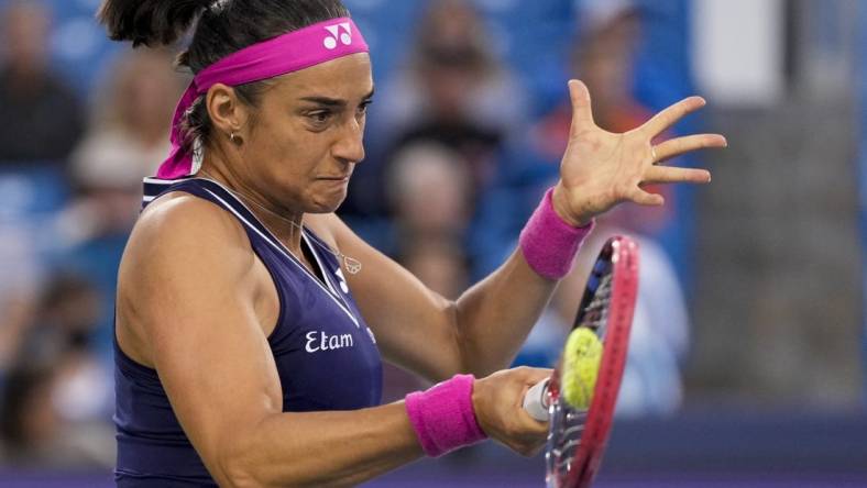 Aug 15, 2023; Mason, OH, USA; Caroline Garcia returns a shot in the first set of a Round of 32 match against Sloane Stephens in the Western & Southern Open at the Lindner Family Tennis Center. Mandatory Credit: Sam Greene-USA TODAY Sports