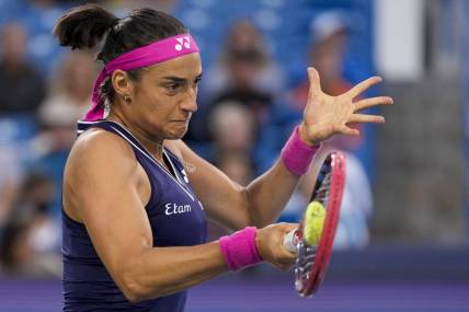 Aug 15, 2023; Mason, OH, USA; Caroline Garcia returns a shot in the first set of a Round of 32 match against Sloane Stephens in the Western & Southern Open at the Lindner Family Tennis Center. Mandatory Credit: Sam Greene-USA TODAY Sports