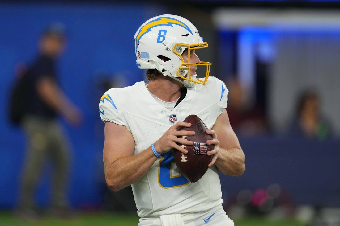 Aug 12, 2023; Inglewood, California, USA;Los Angeles Chargers quarterback Max Duggan (8) throws the ball aagainst the Los Angeles Rams in the second half at SoFi Stadium. Mandatory Credit: Kirby Lee-USA TODAY Sports