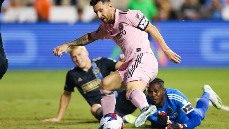 Aug 15, 2023; Chester, PA, USA; Inter Miami forward Lionel Messi (10) shoots the ball against Philadelphia Union goalkeeper Andre Blake (18) in front of defender Jakob Glesnes (5) at Subaru Park. Mandatory Credit: Bill Streicher-USA TODAY Sports