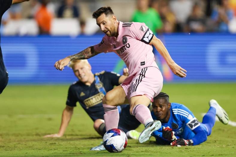 Aug 15, 2023; Chester, PA, USA; Inter Miami forward Lionel Messi (10) shoots the ball against Philadelphia Union goalkeeper Andre Blake (18) in front of defender Jakob Glesnes (5) at Subaru Park. Mandatory Credit: Bill Streicher-USA TODAY Sports
