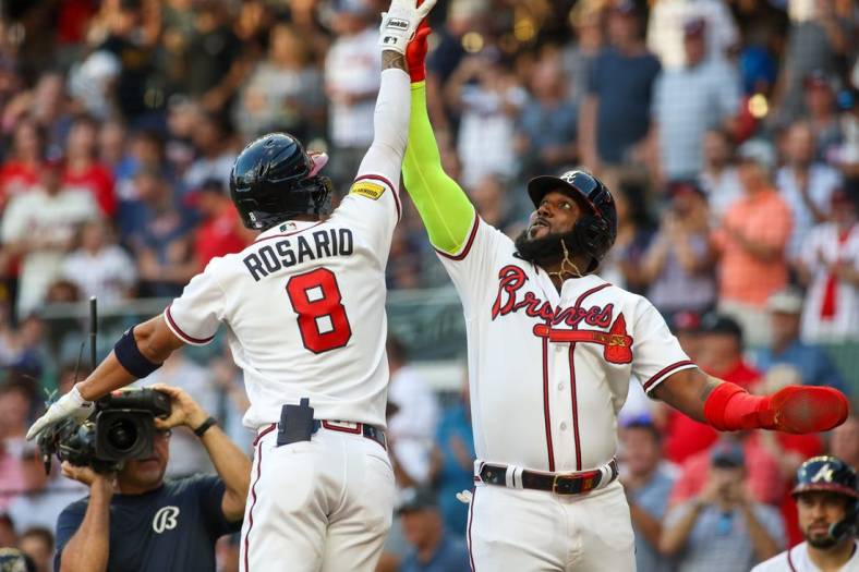 Aug 16, 2023; Atlanta, Georgia, USA; Atlanta Braves left fielder Eddie Rosario (8) celebrates after a home run with designated hitter Marcell Ozuna (20) against the New York Yankees in the second inning at Truist Park. Mandatory Credit: Brett Davis-USA TODAY Sports
