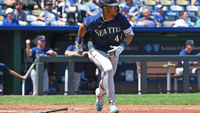 Aug 17, 2023; Kansas City, Missouri, USA;  Seattle Mariners center fielder Julio Rodriguez (44) runs to first base after hitting an RBI single in the second inning against the Kansas City Royals at Kauffman Stadium. Mandatory Credit: Peter Aiken-USA TODAY Sports