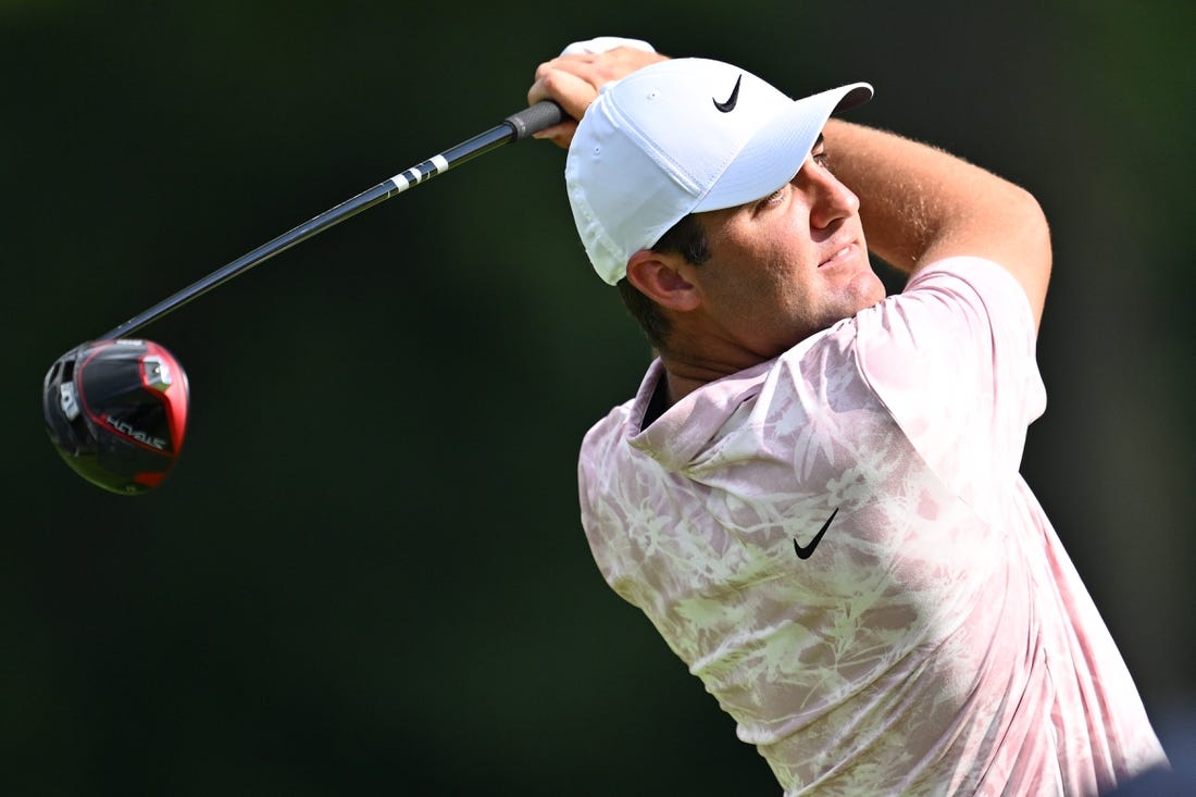 Aug 17, 2023; Olympia Fields, Illinois, USA; Scottie Scheffler tees off from the 7th tee during the first round of the BMW Championship golf tournament. Mandatory Credit: Jamie Sabau-USA TODAY Sports