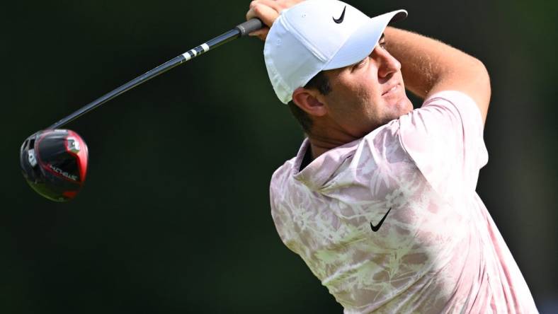 Aug 17, 2023; Olympia Fields, Illinois, USA; Scottie Scheffler tees off from the 7th tee during the first round of the BMW Championship golf tournament. Mandatory Credit: Jamie Sabau-USA TODAY Sports